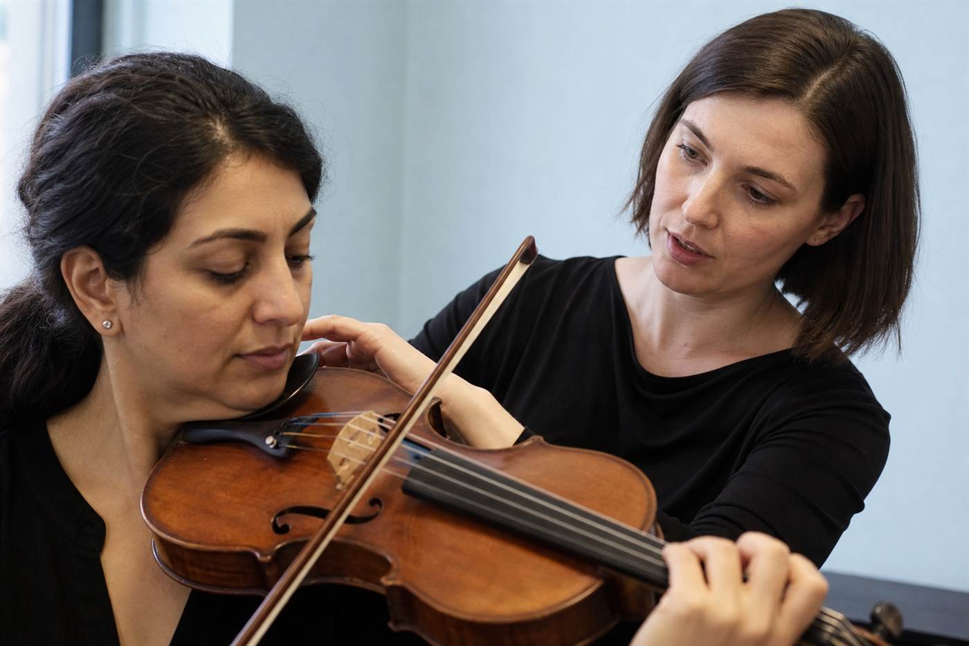 Violinist studying a bowed phrase