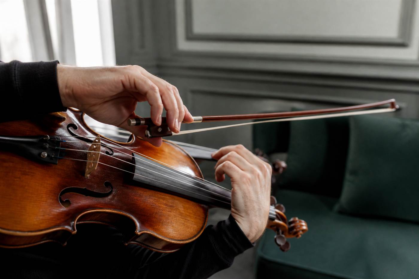 Violin teacher offering posture guidance